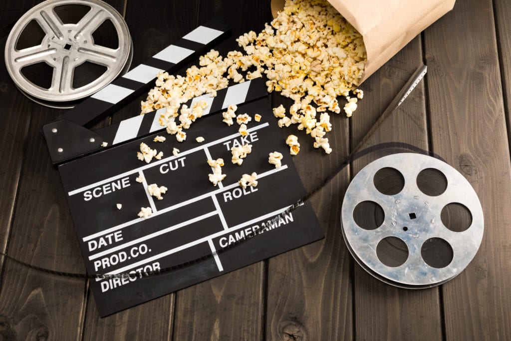 Filmtipps: Grafik mit Popcorn, Filmrolle und Klappe